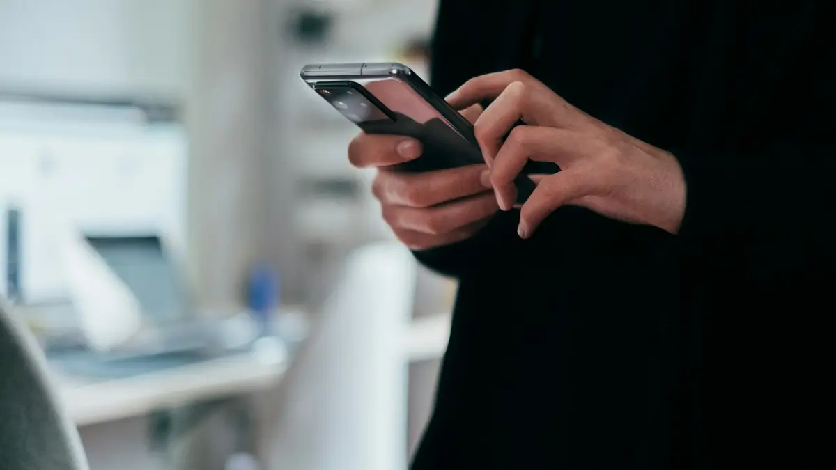 A person holding a smartphone in both hands